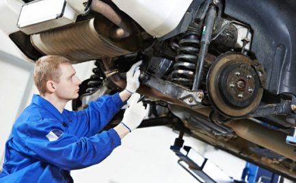 Car Mechanic Inspecting Wheel & Suspension — Diesel Mechanic in Yandina, QLD