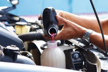 Mechanic Filling Car Cooling System — Diesel Mechanic in Yandina, QLD