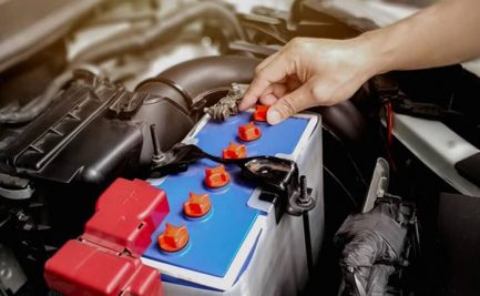 Man Inspecting Car Battery — Diesel Mechanic in Yandina, QLD