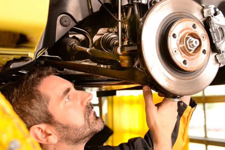 Mechanic Inspecting Crane's Axle & Suspension — Diesel Mechanic in Yandina, QLD