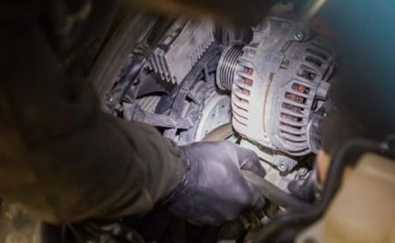Mechanic Inspecting Truck Alternator — Diesel Mechanic in Yandina, QLD
